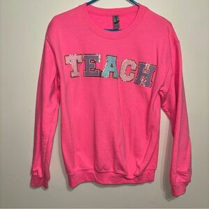 Pink Sweatshirt with 'TEACH' Patches
